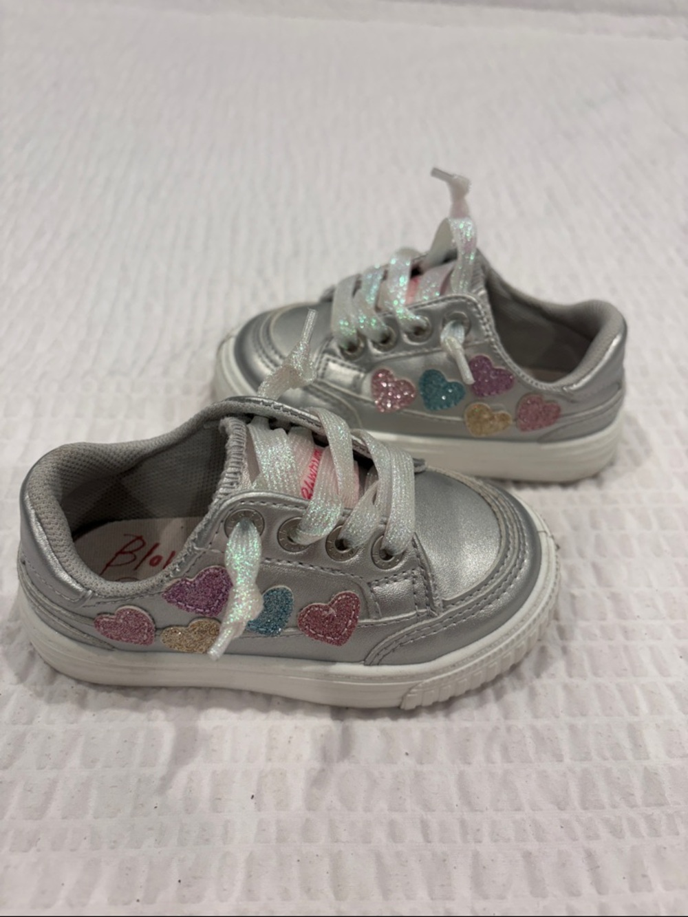 Blowfish Toddler Silver Sneakers with Multicolor Glitter Hearts
Size 6